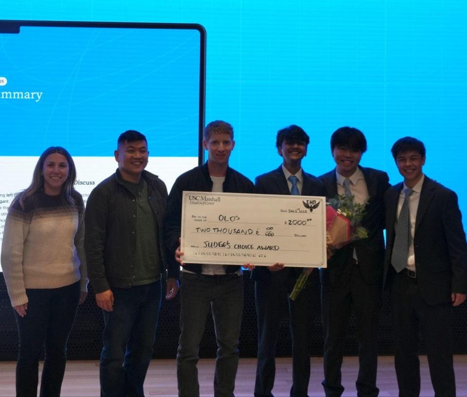 Olos team accepting the Judges' Choice Award